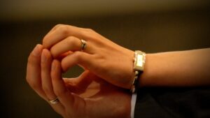 wedding-rings-holding-hands-1200-800-1140x641